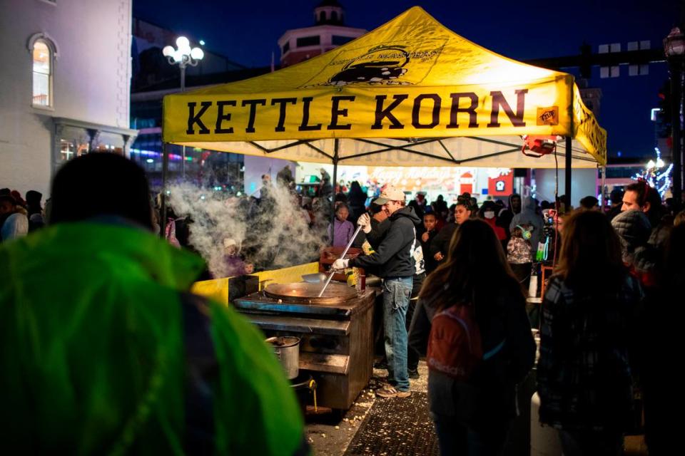 People lined up for kettle corn cooked fresh at Triangle Park in Lexington.