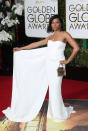 <p>Wearing a crisp white Stella McCartney dress, with a dramatic cape at the 2016 Golden Globes. <i>[Photo: Rex]</i></p>