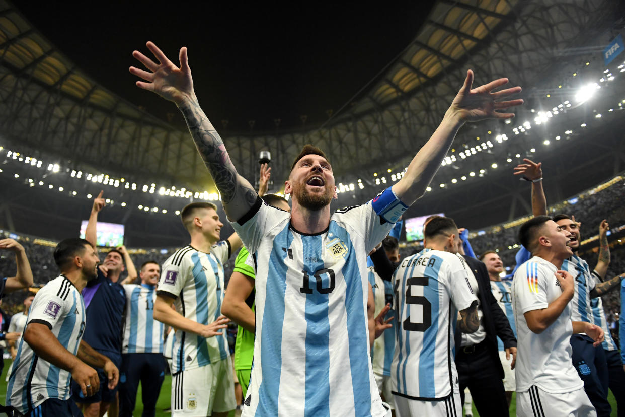 LUSAIL CITY, QATAR - DECEMBER 18: Lionel Messi of Argentina celebrates with teammates after the victory in the penalty shoot out during the FIFA World Cup Qatar 2022 Final match between Argentina and France at Lusail Stadium on December 18, 2022 in Lusail City, Qatar. (Photo by David Ramos - FIFA/FIFA via Getty Images)