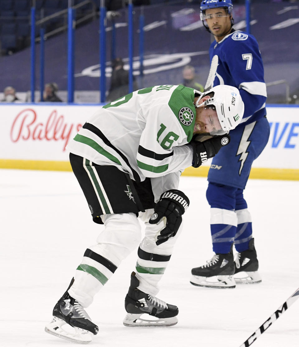 Dallas Stars center Joe Pavelski (16) heads to the bench after being hit by the puck during the first period of the team's NHL hockey game against the Tampa Bay Lightning on Friday, May 7, 2021, in Tampa, Fla. (AP Photo/Jason Behnken)