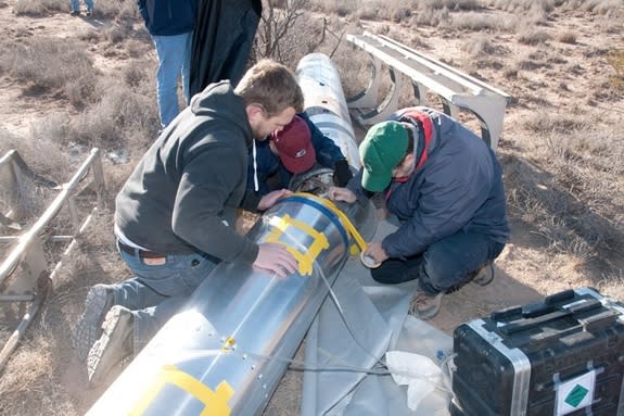 To analyze a mysterious X-ray glow in the sky, researchers modified a detector used in the 1970s. Here the researchers recover the detector, after it was launched into the Earth's atmosphere for five minutes.