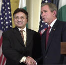 FILE - Then U.S. President Bush, right, shakes hands with then Pakistani President Pervez Musharraf at a news conference at New York's Waldorf - Astoria Hotel, on Nov. 10, 2001. An official said Sunday, Feb. 5, 2023, Gen. Musharraf, Pakistan military ruler who backed U.S. war in Afghanistan after 9/11, has died.(AP Photo/Ed Bailey, File)