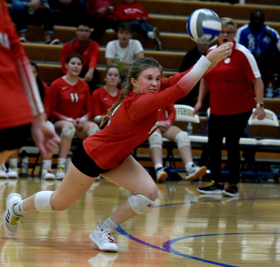 Hailey Knox of Milan dives to pass the ball in the Division 2 District semifinals against Airport Thursday.