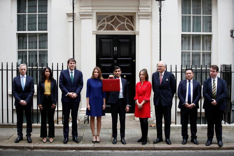 Chancellor of the Exchequer Sunak holds the budget box outside Downing Street in London