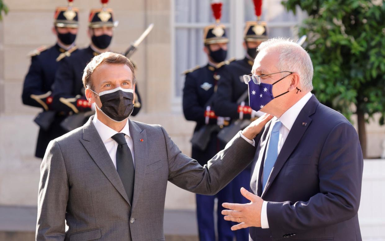 File photo: Emmanuel Macron welcomes Australian prime minister Scott Morrison in June - PASCAL ROSSIGNOL/PASCAL ROSSIGNOL