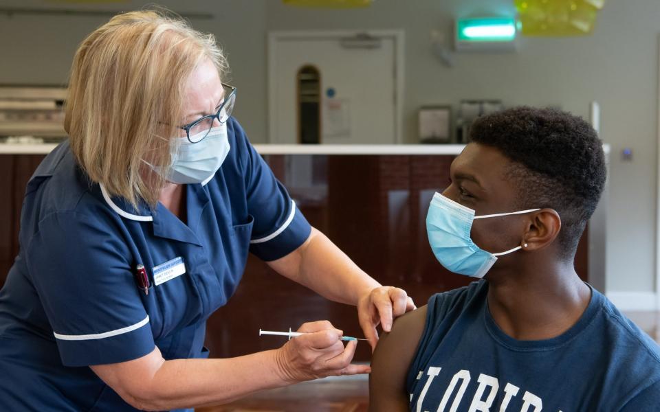 Brighton and Sussex Medical School student Dibon Somarib being vaccinated by Practice Nurse Janet Devlin at Sussex University - STUART ROBINSON