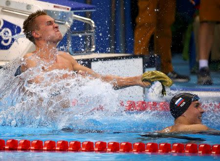 2016 Rio Olympics - Swimming - Final - Men's 200m Breaststroke Final - Olympic Aquatics Stadium - Rio de Janeiro, Brazil - 10/08/2016. Dmitriy Balandin (KAZ) of Kazakhstan celebrates after winning. REUTERS/David Gray