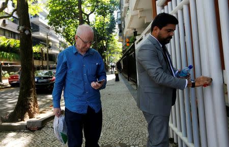 Former top European member of the International Olympic Committee (IOC), Patrick Hickey (L), arrives at a residential building after leaving the Bangu Jails Complex in Rio de Janeiro, Brazil, August 30, 2016. REUTERS/Ricardo Moraes