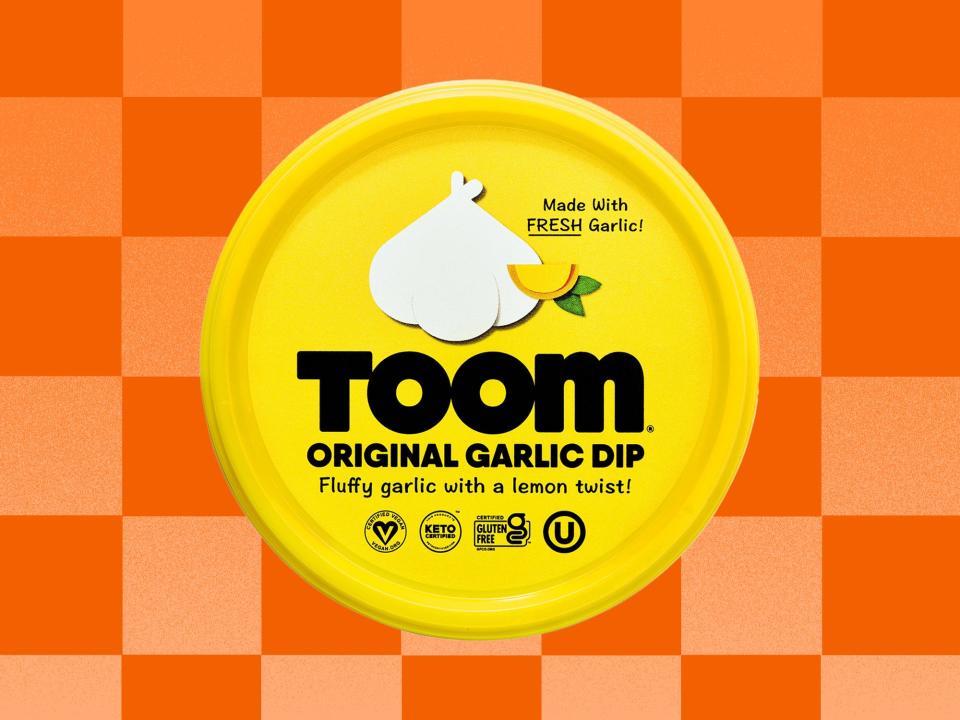 Toom Garlic Dip on an orange checkered background