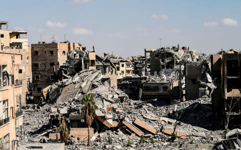 The damage near the central hospital of the embattled northern Syrian city of Raqqa - Credit: AFP