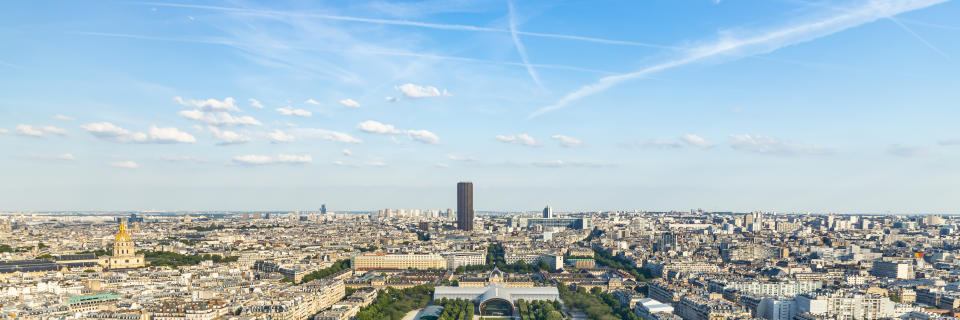 Urban skyline of Paris with the Montparnasse tower seen from the second floor of the Eiffel Tower in France