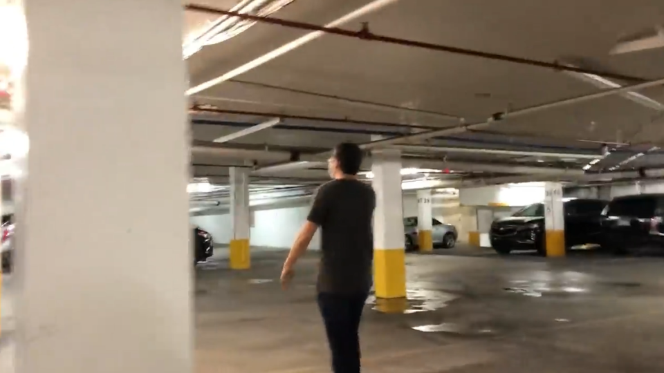 Puddle under a column supporting the Champlain Towers South pool deck, shown in July 2020 video.