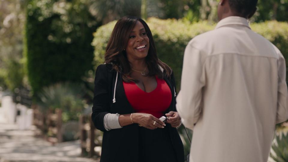 Niecy Nash-Betts as Simone smiling in The Rookie: Feds season 1
