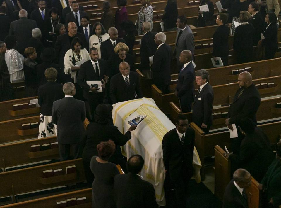 Pallbearers help carry the casket of longtime Miami Times publisher Garth C. Reeves Sr. after his funeral service at the Historic Saint Agnes Episcopal Church in Miami on Friday, Dec. 6, 2019.