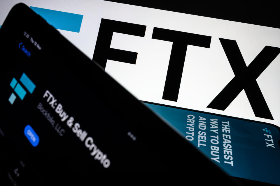 LONDON, ENGLAND - NOVEMBER 10: In this photo illustration the FTX logo and mobile app adverts are displayed on screens on November 10, 2022 in London, England. The Bahamas-based crypto exchange's larger rival, Binance, walked away from a potential bailout deal, as FTX struggles with a wave of customer withdrawals that have created a liquidity crunch. (Photo Illustration by Leon Neal/Getty Images)
