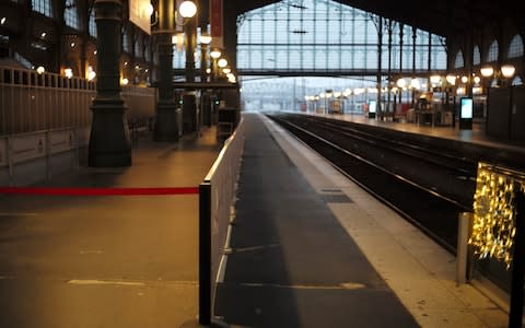 The empty Gare Du Nord in Paris, as tourists cancel travel plans and the authorities deploy thousands of police as France girds for massive, nationwide strikes and protests - Credit: Rafael Yaghobzadeh/AP