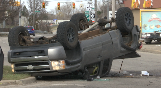 A truck flipped as the result of a three-car accident near Homer and Saginaw. (WLNS)