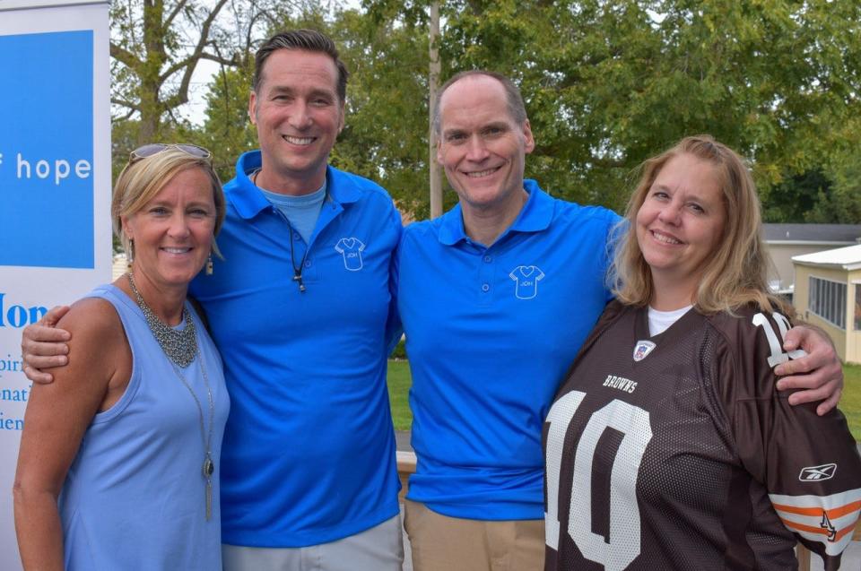 Jerseys of Hope founders, Monica Biemer and John Biemer, on left, stand with Jerseys of Hope board member, Gene Biros and family friend, Leslie Burke at the organization’s Sept. 16 fundraiser at The Catawba Inn.