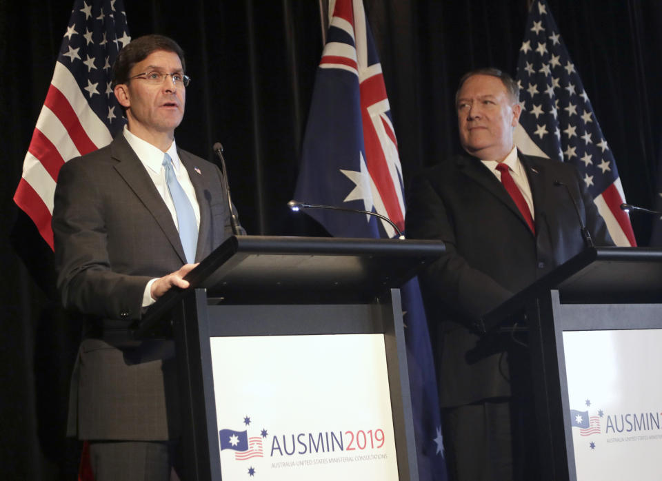 U.S. Secretary of Defense Mark Esper, left, and U.S. Secretary of State Mike Pompeo brief the media at a press conference following annual bilateral talks with Australian counterparts in Sydney, Australia, Sunday, Aug. 4, 2019. (AP Photo/Rick Rycroft)