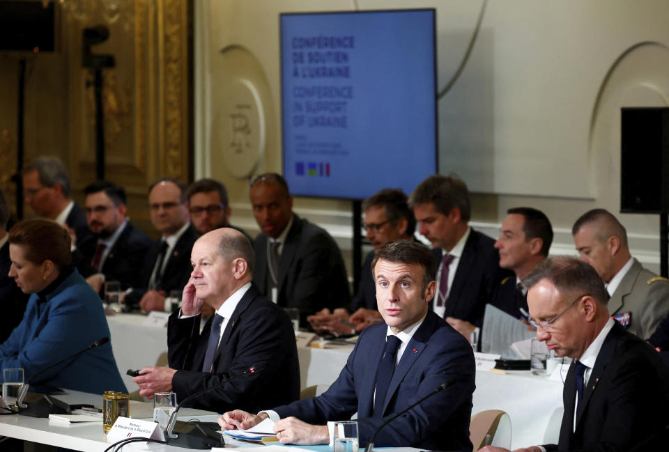 French President Emmanuel Macron, center right, delivers a speech at the Elysee Palace in Paris, Monday, Feb. 26, 2024. More than 20 European heads of state and government and other Western officials are gathering in a show of unity for Ukraine, signaling to Russia that their support for Kyiv isn't wavering as the full-scale invasion grinds into a third year. (Gonzalo Fuentes/Pool via AP)