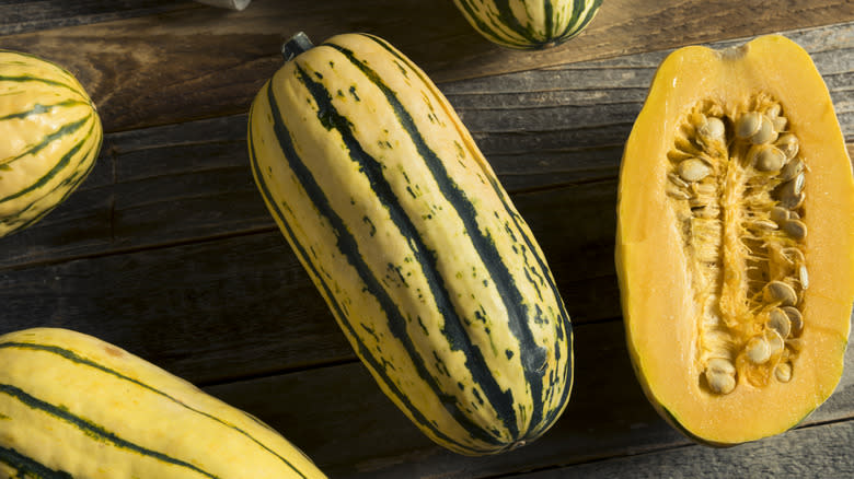 Delicata squash on wooden board