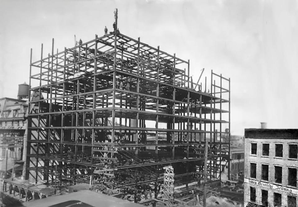 The 10-story Hotel Utica was a skeleton of steel in May 1911, but in 10 months—on March 12th, 1912—it would open as one of the most modern hotels between New York City and Chicago. In 1926, four stories were added, making it a 14-story hotel with 350 rooms. The building at the lower right—on the northeast corner of Lafayette and Seneca streets—was the headquarters of the German-language newspaper, the Utica Deutsche Zeitung.