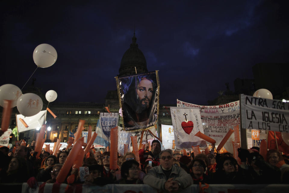 Members of Catholic groups protest outside Argentina's Congress against a same-sex marriage bill in Buenos Aires, Tuesday, July 13, 2010. Argentina subsequently became the first Latin American country to legalize same-sex marriage. (AP Photo/Natacha Pisarenko)