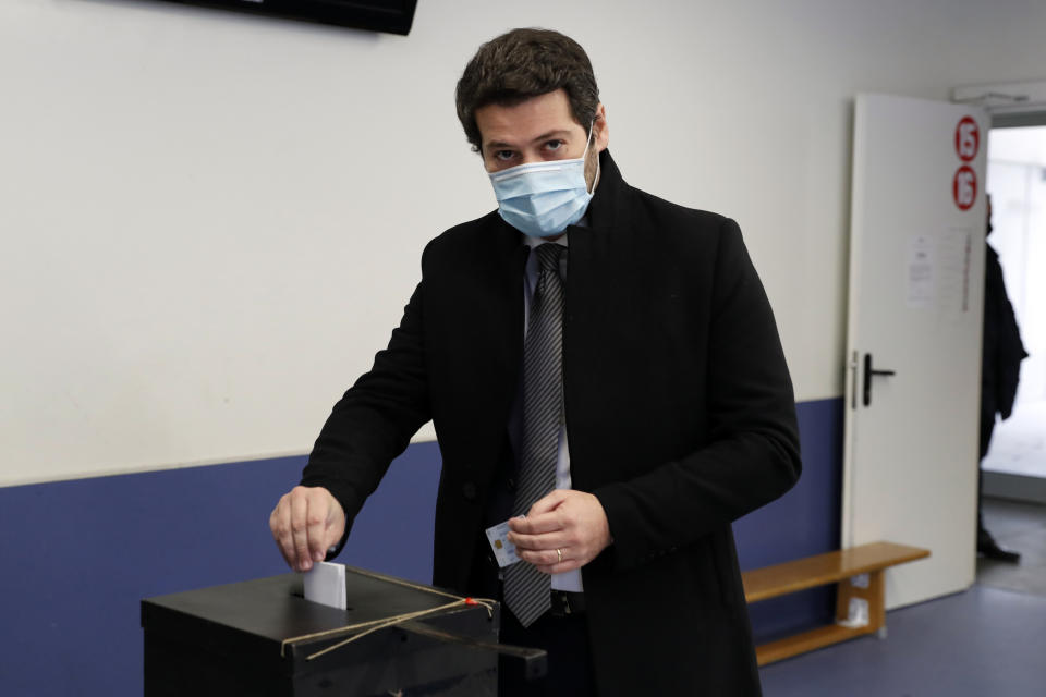 Right-wing populist presidential candidate Andre Ventura casts his ballot at a polling station in Lisbon, Sunday, Jan. 24, 2021. Portugal holds a presidential election Sunday, choosing a head of state to serve a five-year term. (AP Photo/Armando Franca)