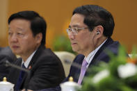 Vietnamese Prime Minister Pham Minh Chinh, right, speaks to Russian President Vladimir Putin, not pictured, during a meeting at the government office in Hanoi, Vietnam Thursday, June 20, 2024. (Luoung Thai Linh/Pool Photo via AP)