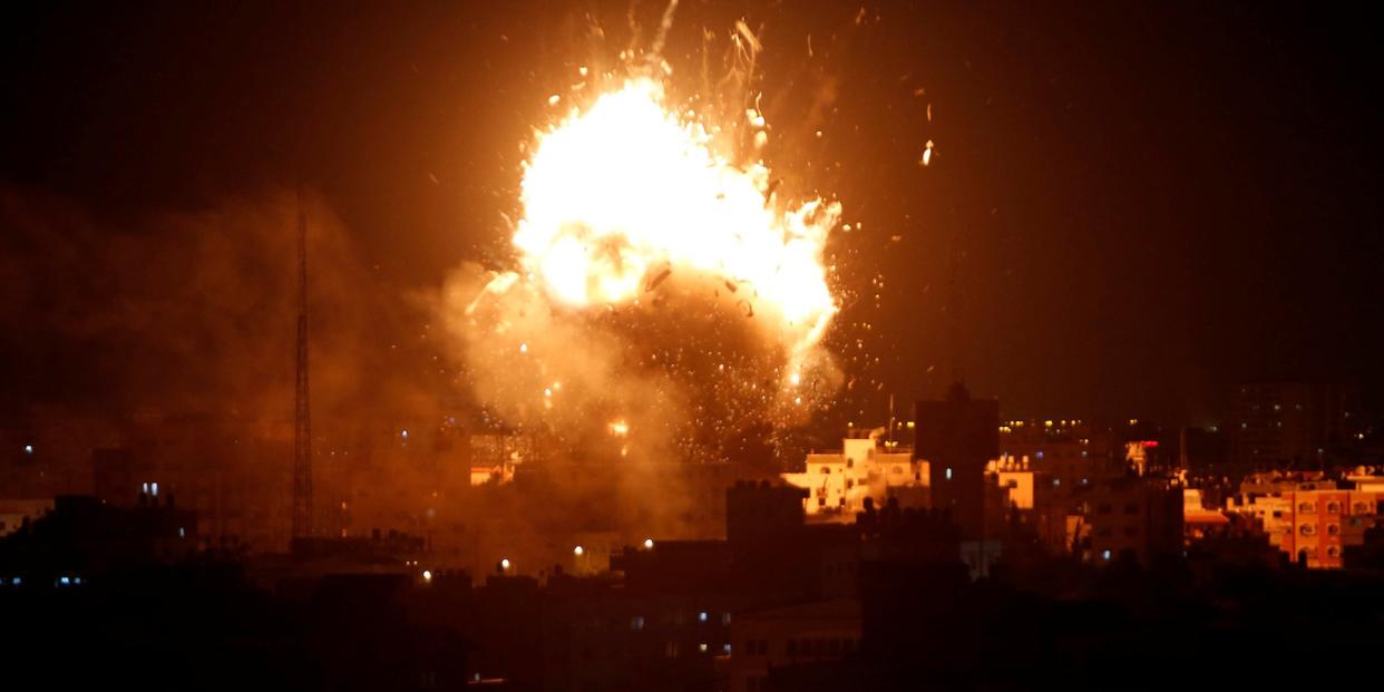 Explosion is seen during an Israeli air strike on Hamas's television station, in Gaza City