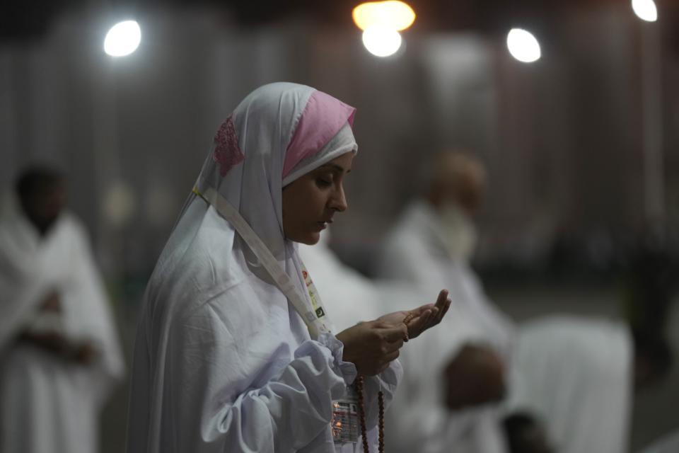 A Muslim pilgrim prays on the Plain of Arafat, during the annual hajj pilgrimage, near the holy city of Mecca, Saudi Arabia, Friday, July 8, 2022. (AP Photo/Amr Nabil)