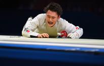 <p>Japan's Kyosuke Matsuyama reacts after loosing against Italy's Daniele Garozzo in the mens individual foil qualifying bout during the Tokyo 2020 Olympic Games at the Makuhari Messe Hall in Chiba City, Chiba Prefecture, Japan, on July 26, 2021. (Photo by Fabrice COFFRINI / AFP) (Photo by FABRICE COFFRINI/AFP via Getty Images)</p> 
