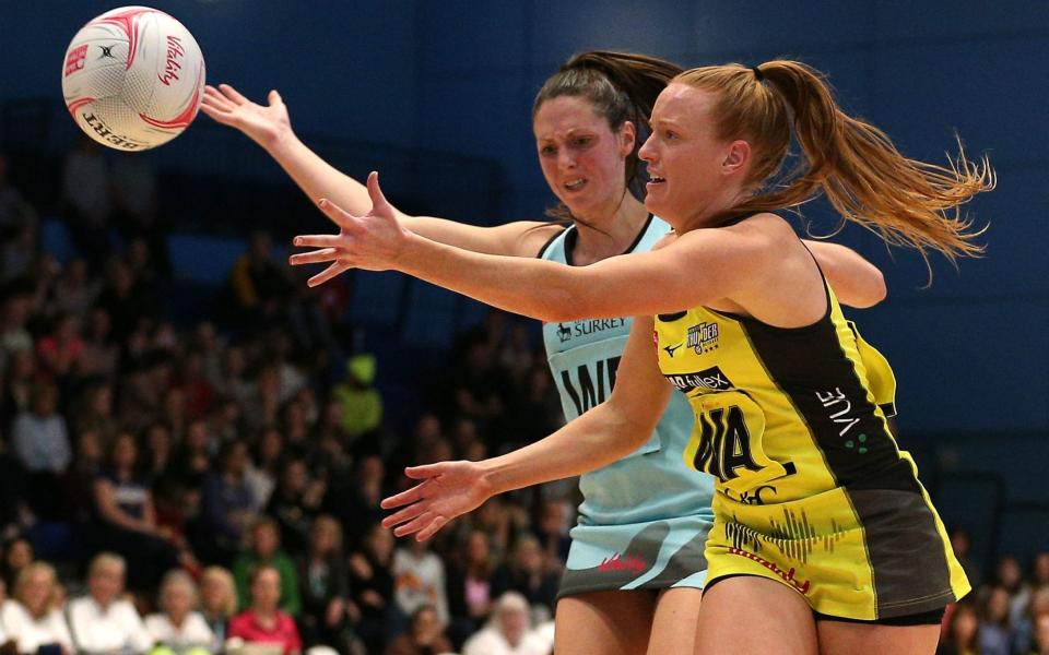 Surrey Storm's Katy Hughes (left) and Manchester Thunder's Ashleigh Neal (left) during the Vitality Netball Super League match - pa