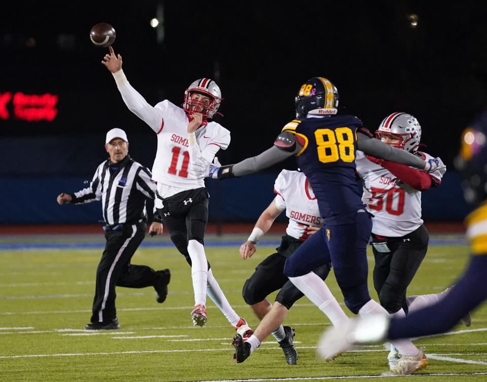 Somers' Matt Fitzsimons (11) makes a pass during the Class A state quarterfinal football game against Lourdes at Middletown High School in Middletown on Friday, November 18, 2022.