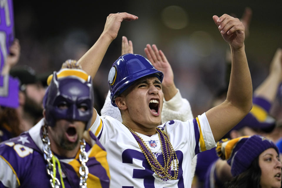 Fans cheer during overtime in an NFL football game between the Minnesota Vikings and the Indianapolis Colts, Saturday, Dec. 17, 2022, in Minneapolis. The Vikings won 39-36. (AP Photo/Abbie Parr)