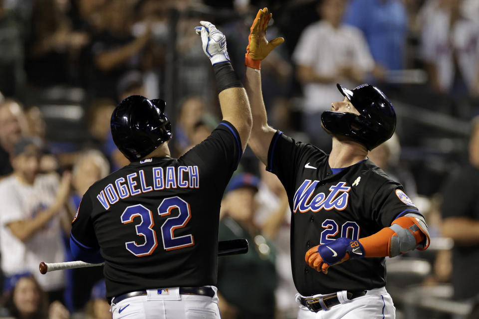 New York Mets' Pete Alonso celebrates his home run with Daniel Vogelbach during the sixth inning of the team's baseball game against the Washington Nationals on Friday, Sept. 2, 2022, in New York. (AP Photo/Adam Hunger)