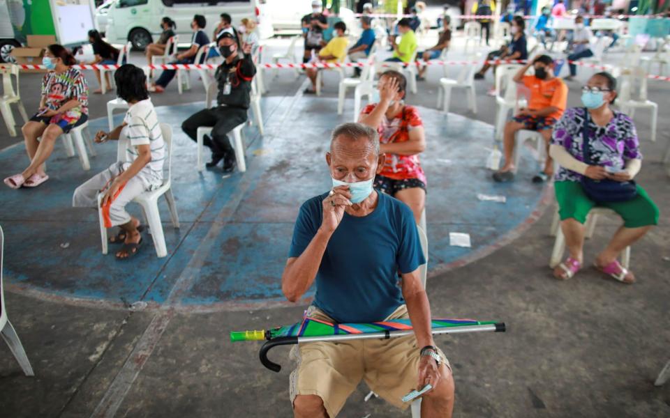 People in Bangkok waiting for a Covid test - Soe Zeya Tun/Reuters