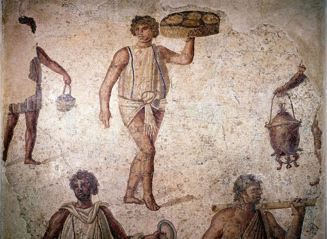 <span>A mosaic of workers making preparations for a feast from second-century Carthage.</span><span>Photograph: Print Collector/Getty Images</span>