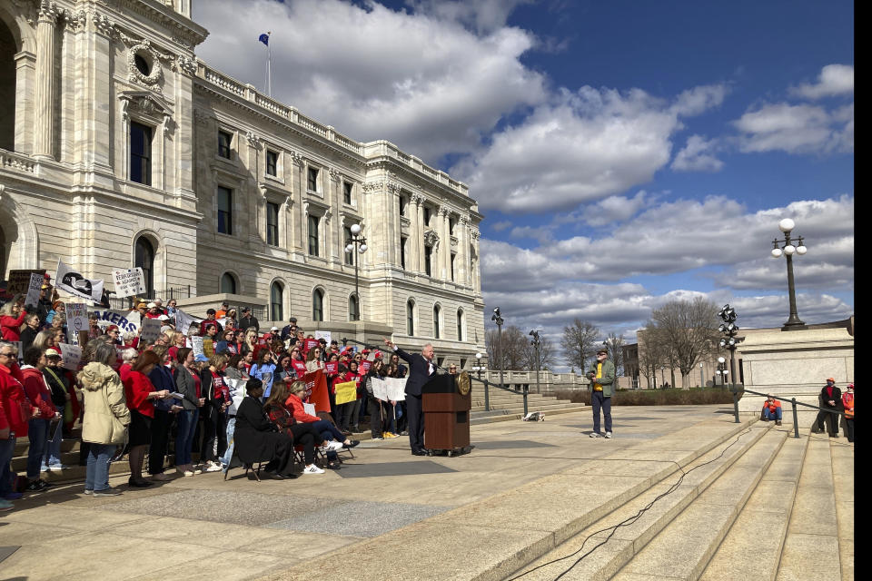 Democratic Minnesota Gov. Tim Walz speaks at a rally on the steps of the Minnesota State Capitol on Tuesday, April 25, 2023, in support of gun safety legislation that was scheduled for debate in the Minnesota Housein Saint Paul, Mich. . (AP Photo/Steve Karnowski)