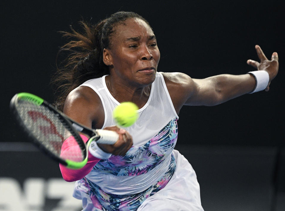 United States' Venus Williams hits a forehand return to France's Alize Cornet during their second round match at the Australian Open tennis championships in Melbourne, Australia, Thursday, Jan. 17, 2019. (AP Photo/Andy Brownbill)