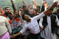 Supporters of India's main opposition Congress party celebrate after the initial poll results at the party headquarters in New Delhi, India, December 11, 2018. REUTERS/Adnan Abidi