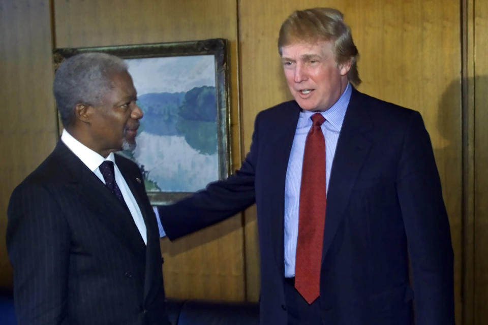 FILE - In this Jan. 9, 2001, file photo, Donald Trump, right, meets with Secretary-General Kofi Annan at the United Nations. When President Donald Trump visits the United Nations building in New York, he’s not just thinking about the global challenges the world body faces, he’s still got in mind the deal that got away. More than a decade later, Trump still relives the overtures he made to rebuild the 39-story tower in the early 2000s and posits that he could have done a better job of it. (AP Photo/Suzanne Plunkett, File)