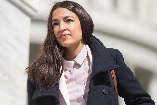 Tom Williams/CQ-Roll Call, Inc via Getty Alexandria Ocasio-Cortez on the House steps of the Capitol on March 27, 2020.