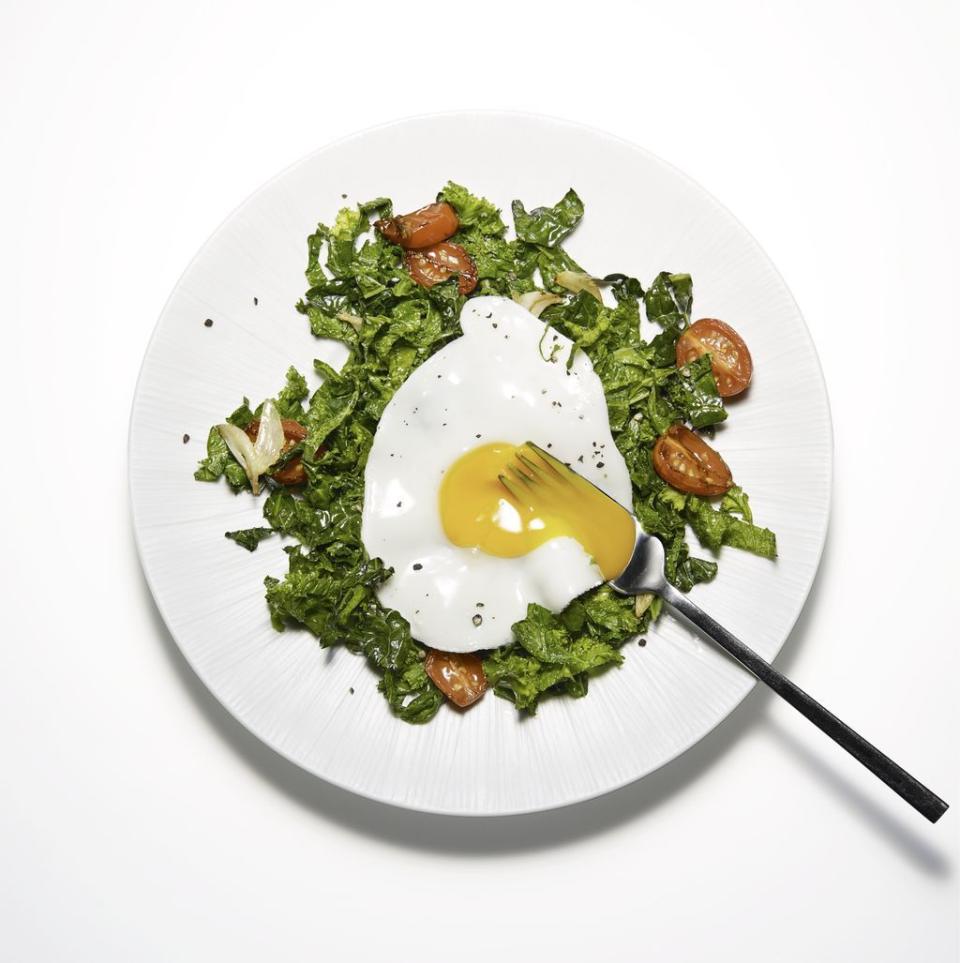 sunny side up eggs on garlicky greens