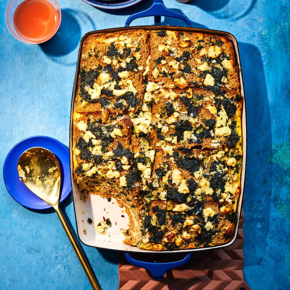 <p>This breakfast casserole is a natural make-ahead choice, as the egg mixture needs plenty of time to soak into the bread before baking. Plus, it's equally delicious hot, room temperature or cold, so guests can help themselves as they wake up.</p> <p> <a href="https://www.eatingwell.com/recipe/7926318/spinach-feta-strata/" rel="nofollow noopener" target="_blank" data-ylk="slk:View Recipe;elm:context_link;itc:0;sec:content-canvas" class="link ">View Recipe</a></p>