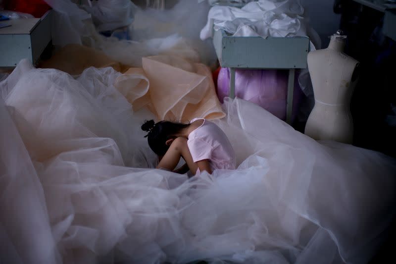 The Wider Image: Coronavirus dampens celebrations in China's wedding gown city