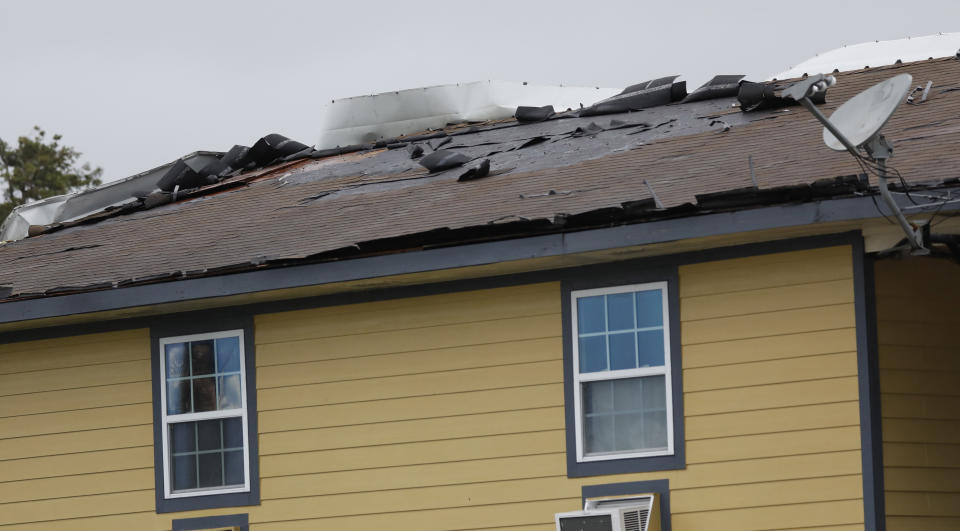 The roof of the Solar's Apartments in Morgan City, La., is damaged by the winds of Tropical Storm Barry, Saturday, July 13, 2019.  Nearly all businesses in Morgan City were shuttered as coastal Louisiana braced for the arrival of Tropical Storm Barry.  (AP Photo/Rogelio V. Solis)