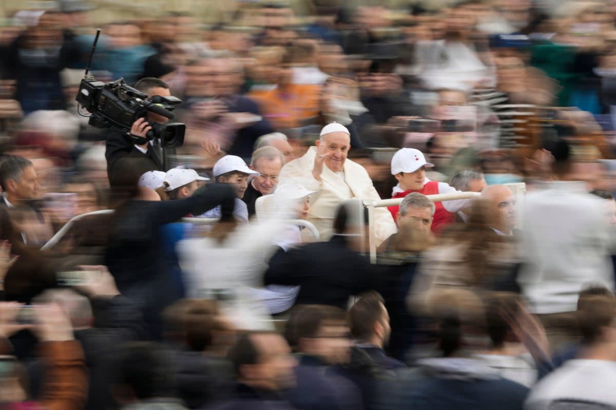 Pope Francis waves as he arrives for his weekly general audience in St Peter’s Square at The Vatican, Wednesday, 5 April 2023 (Associated Press)