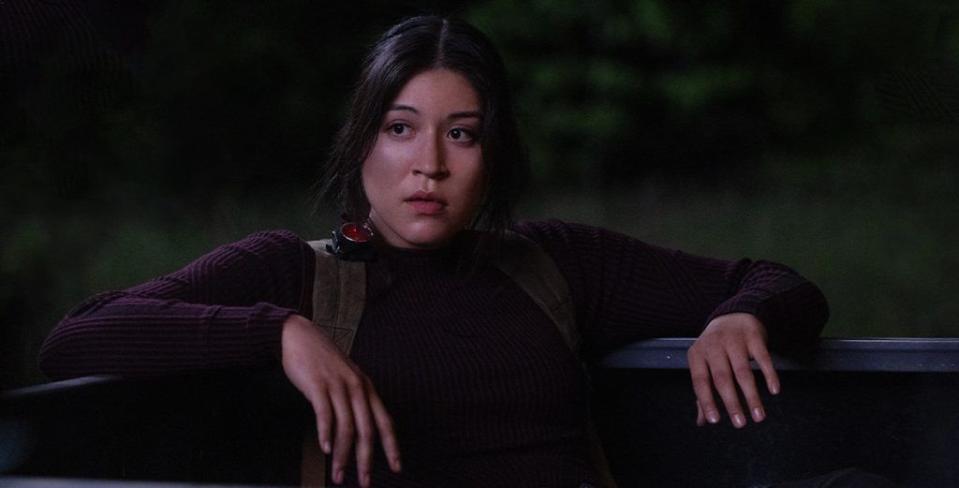 a woman sitting in the back of a truck