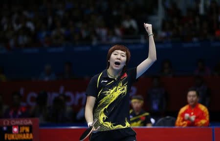 China's Li Xiaoxia celebrates after defeating Japan's Ai Fukuhara in their women's team gold medal table tennis singles match at the ExCel venue during the London 2012 Olympic Games August 7, 2012. REUTERS/Darren Staples